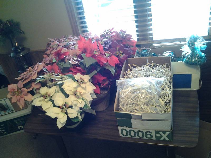 lot 107 image: Quality Artificial Poinsettias, White Cord Lights, Balloon Weights