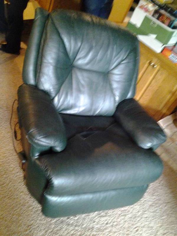 lot 128 image: Leather Like, Vibrating Swivel Recliner, Bear Blanket, Decorator Pillow