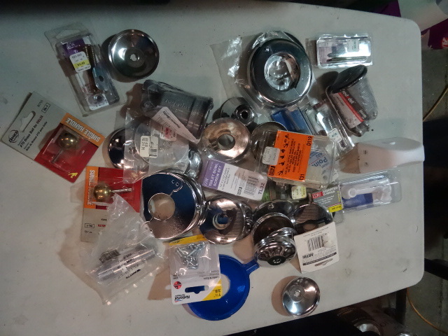 lot 106 image: NEW PLUMBING LOT incl. Delta Brass Handle Ball Replacements, Toilet Bolts, Escution plates and more