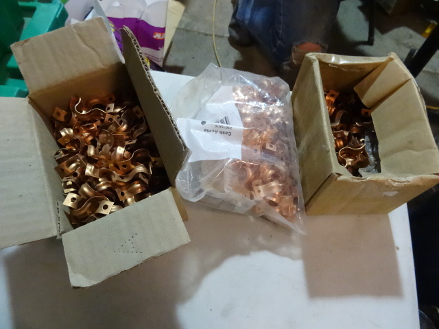 lot 129 image: NEW LOT 1  2 in Copper Coated Pipe Hangers Approx 300 pcs