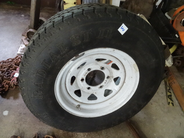 lot 200 image: New Spare Tire with 6 Hole Rim.