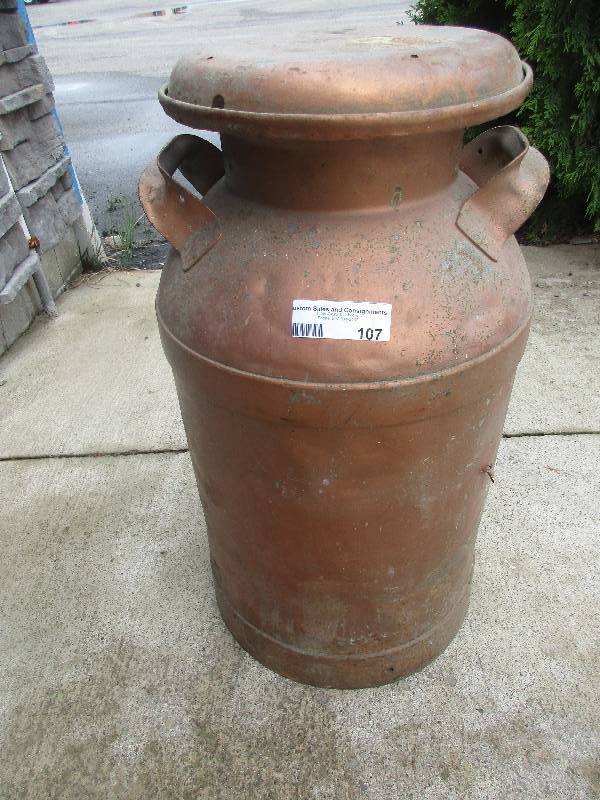 lot 107 image: vintage metal milk jug