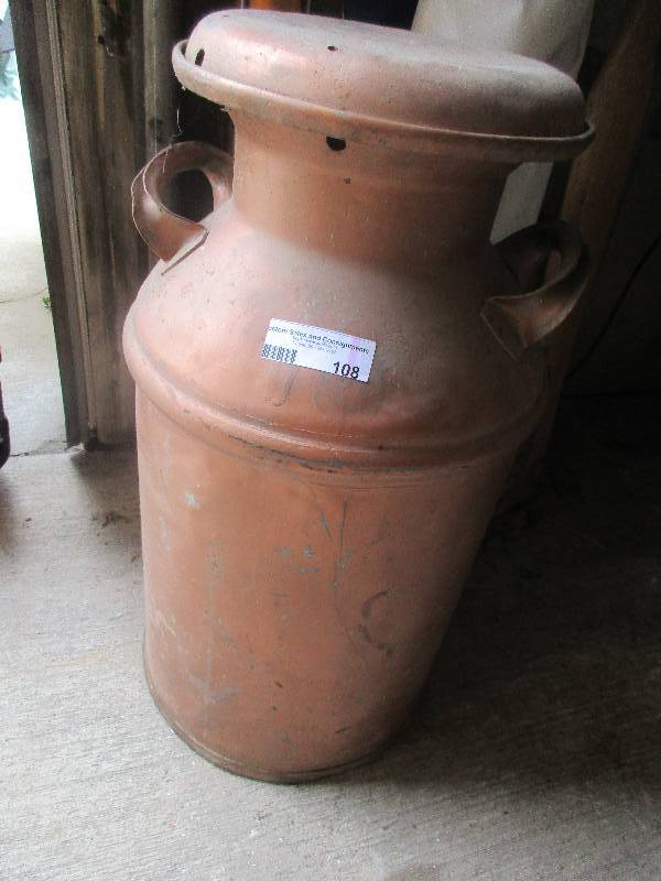 lot 108 image: vintage metal milk jug