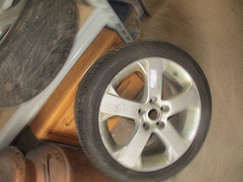 lot 113 image: 2 mazda rims and tires 5 lug 20550 zr17