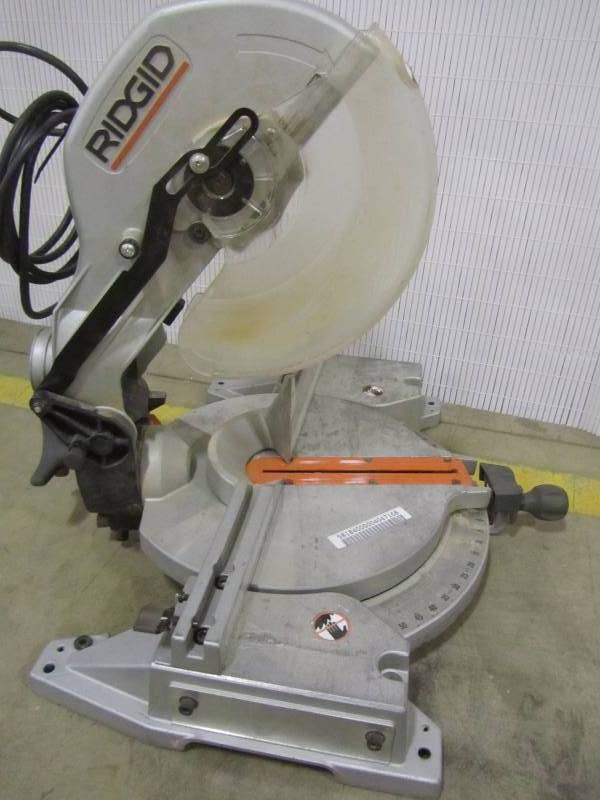 lot 44 image: RIDGID 15 Amp 10 in. Dual Bevel Miter Saw