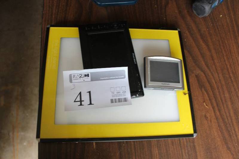 lot 41 image: Lot of (3) Electronics Includes TomTom GPS, First Alert 7in. Wireless Monitor, Porta Trace The Light Panel