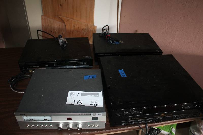 lot 26 image: Lot of (4) Electronics Includes Drake ESR 240 Earth Station Receiver, BLAH C69ES High Density Linear Converter, Magnavox CD1000 Compact Disc Player, Pioneer DV-525 DVD Player