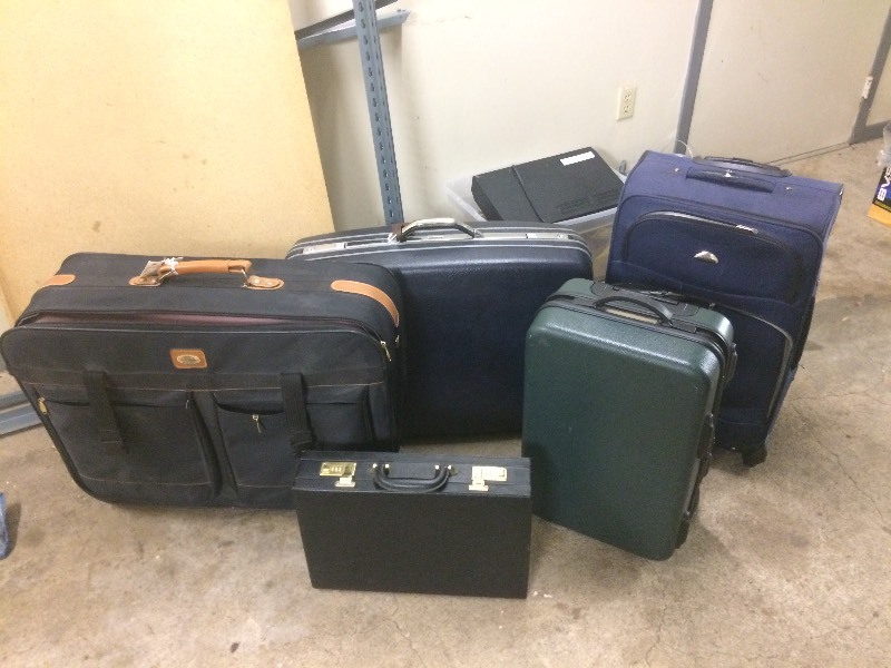 lot 99 image: Suitcases & Briefcase