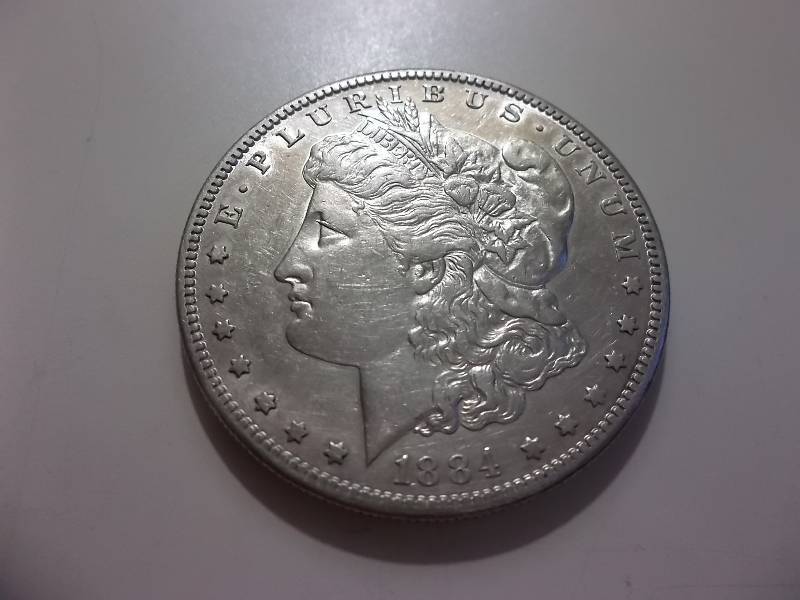 1884 S Morgan Silver Dollar Higher Grade AU (In AU Valued $250.00)