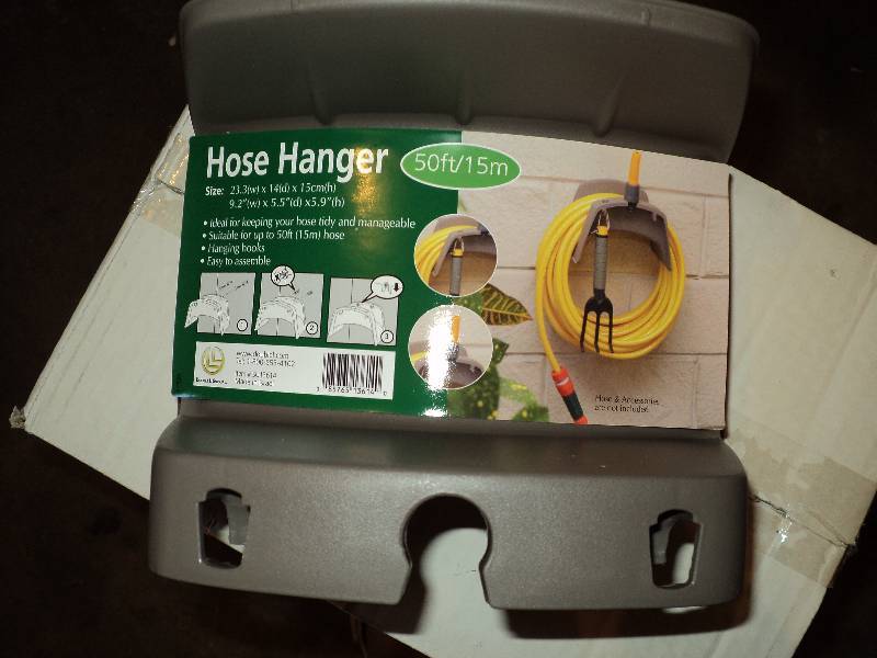 lot 18 image: box of hose hangers, 48 per box...