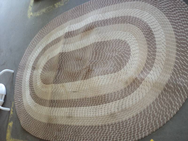 lot 100 image: oval rug 67inx99in needs repair...