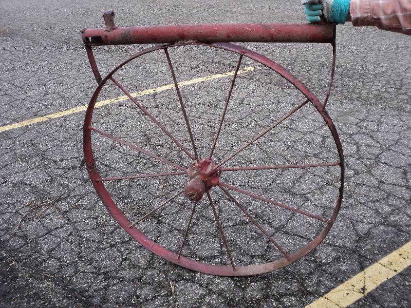lot 12 image: red metal wheel, 41in diameter...