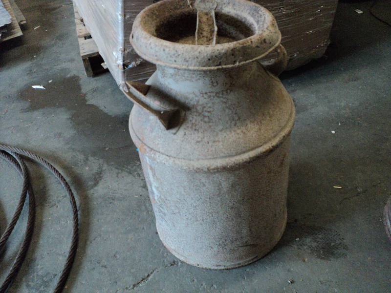 lot 68 image: rusty milk can...