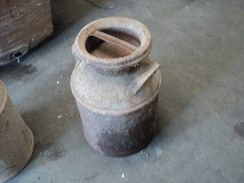 lot 69 image: rusty milk can...
