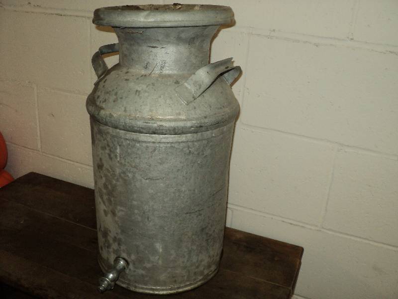 lot 81 image: milk can with spigot, 20 in tall...