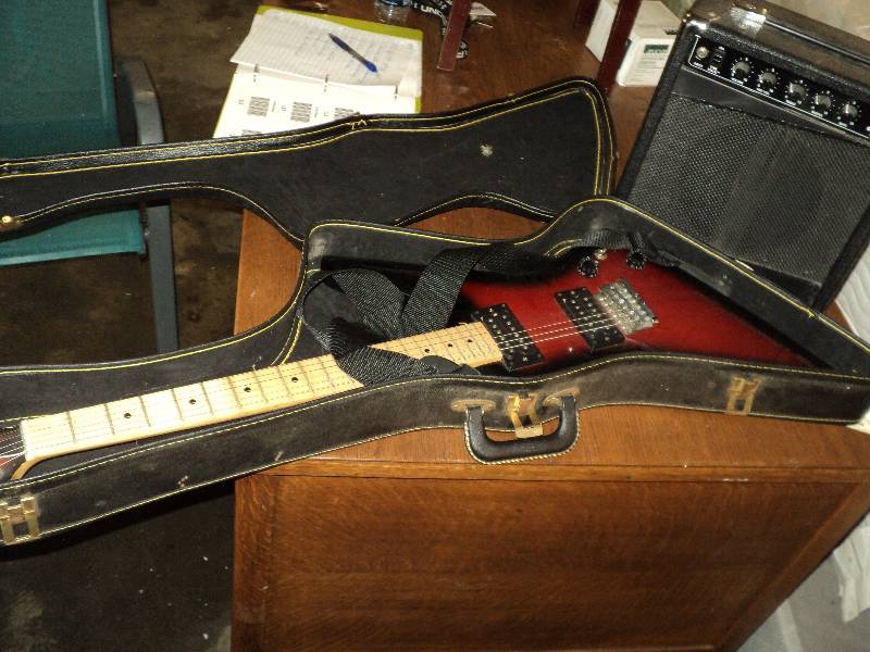 lot 114 image: electric guitar with amp and case...
