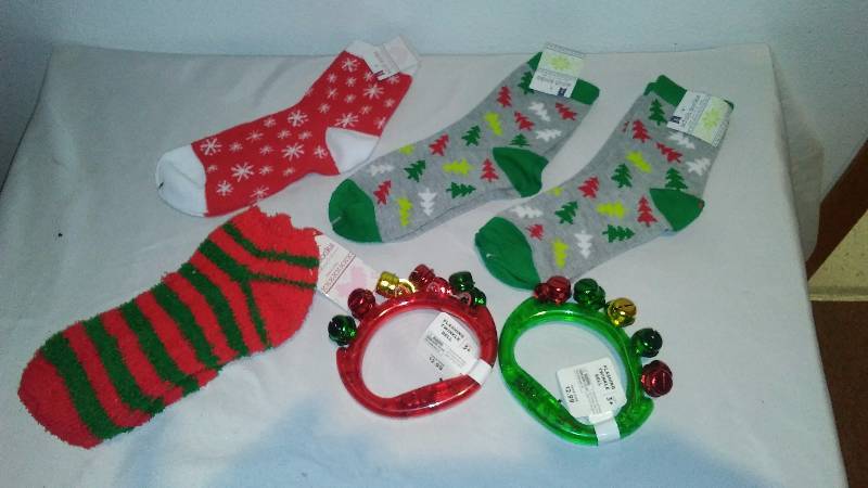 lot 50 image: Holiday Socks (4) and Handle Jingle Tambourine (2)