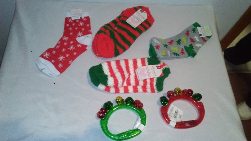 lot 52 image: Holiday Socks (4) and Handle Jingle Tambourine (2)