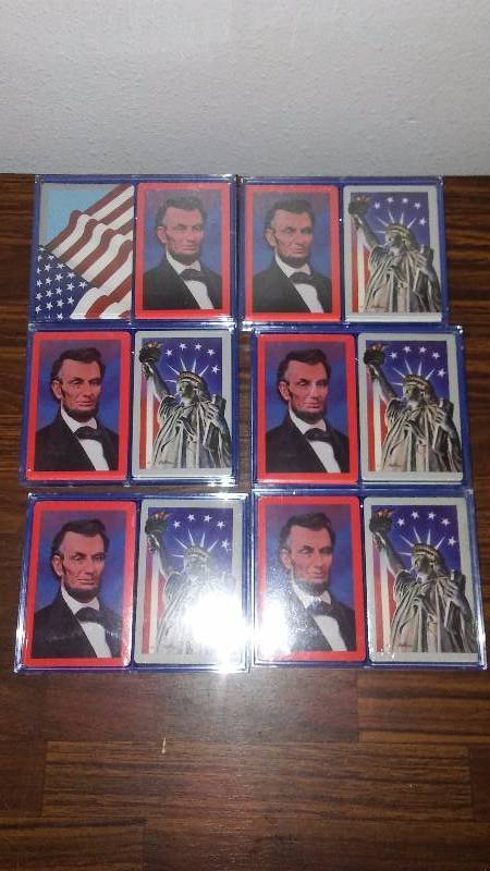 lot 103 image: Patriotic Playing Cards (6) 2 decks per set, 12 decks in all, Abraham Lincoln, American Flag and Statue of Liberty.