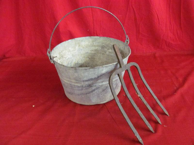pail and potato fork end
