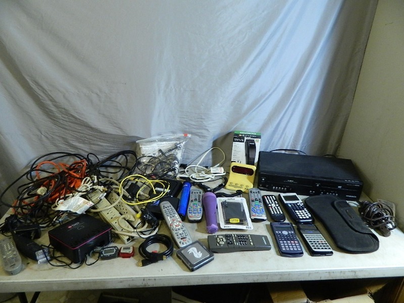 lot 87 image: Calculators, Assorted Electronics, Cords, and More