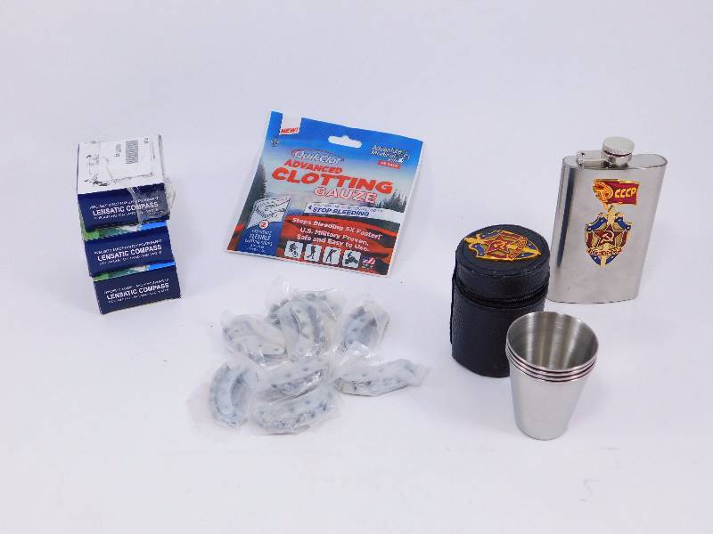 lot 45 image: Military-Style Lensatic Compasses, 3 Pack, QuikClot Advanced Clotting Gauze, Russian Military Surplus Flask and Shot Glass Set,  Germam Military Issue Steel Shoe Taps