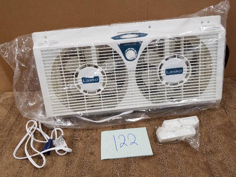 lot 122 image: Lasko 2138 8 in. Electrically Reversible Twin Window Fan in like new working conditions