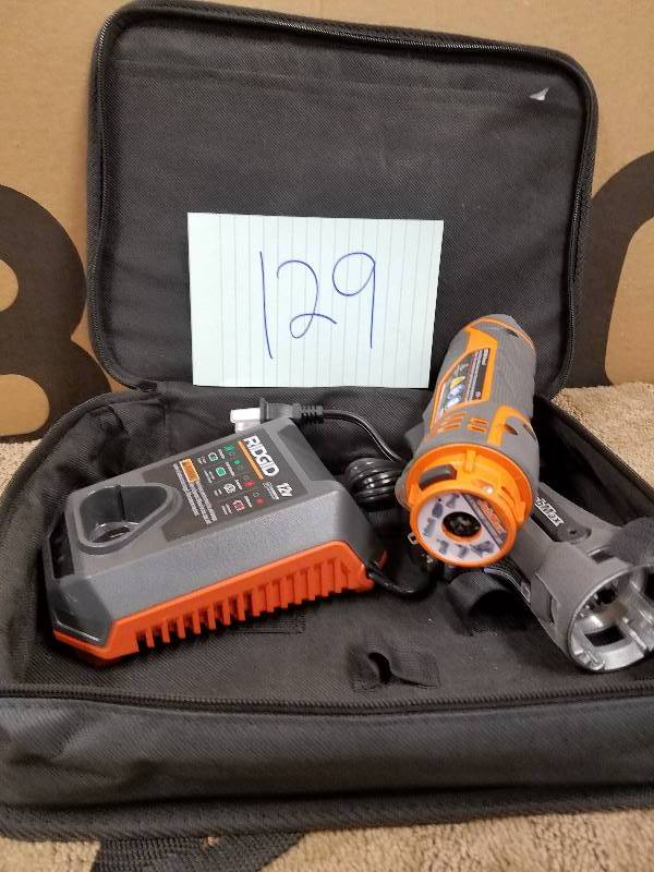 lot 129 image: RIDGID  JobMax 12-Volt Multi-Tool with Tool Free Head Tool and charger only In like New working conditions
