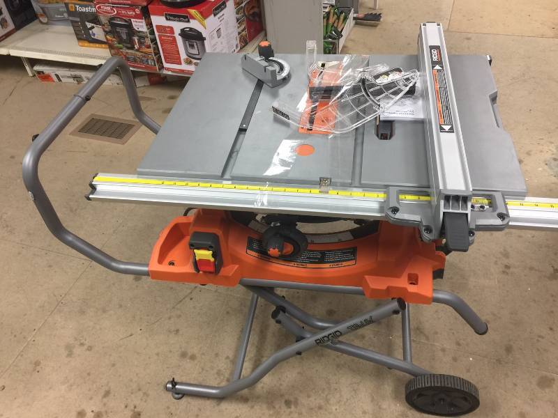 lot 33 image: RIDGID 15 Amp 10 in. Heavy-Duty Portable Table Saw with Stand  in like New conditions