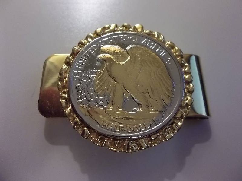 lot 70 image: Walking Liberty Money Clip With Eagle Highlighted In Gold.