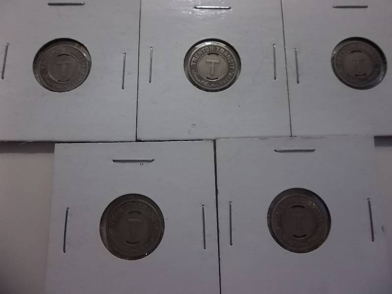 lot 87 image: 5 Vintage Bus Tokens Stamped Trenton Transit Slabbed