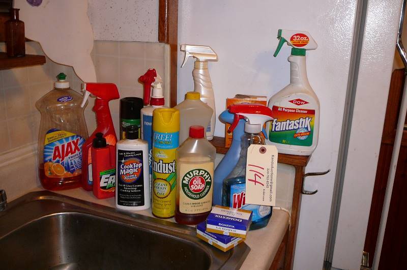 lot 114 image: Misc. Kitchen Cleaning items, Windex, soap, ajax, endust, pine cleaner, febreze, grease lighting full bottle. downy