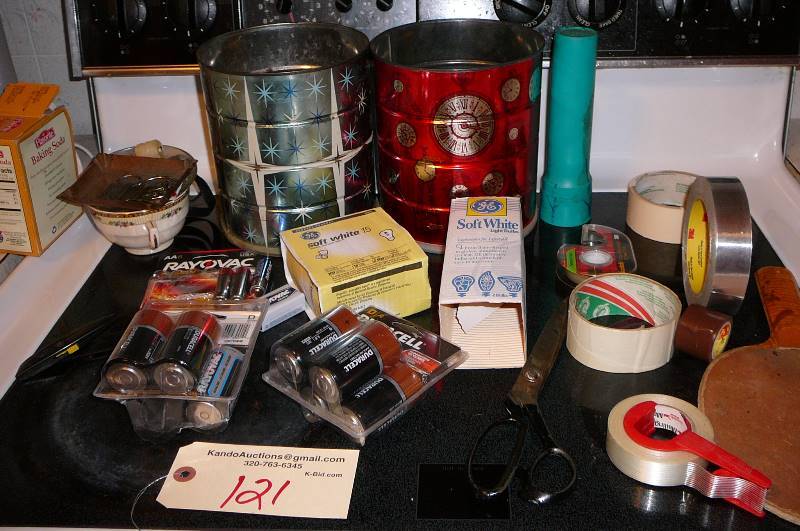 lot 121 image: Misc. Household items, pack of batteries, light bulbs, tape