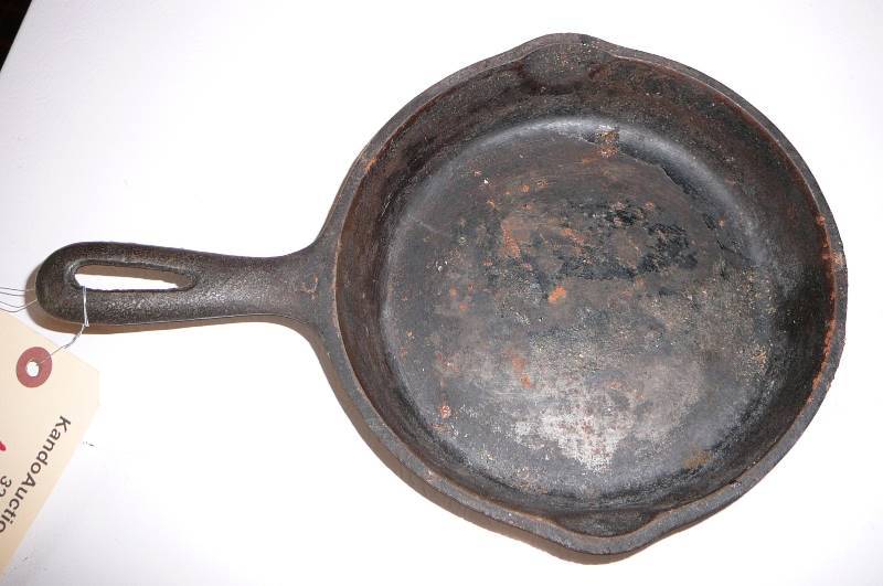 lot 130 image: Cast Iron #6 pan, shelf, Shovel, Plaque, wooden Kitchen utensil set , Bird chime, Mail sorter
