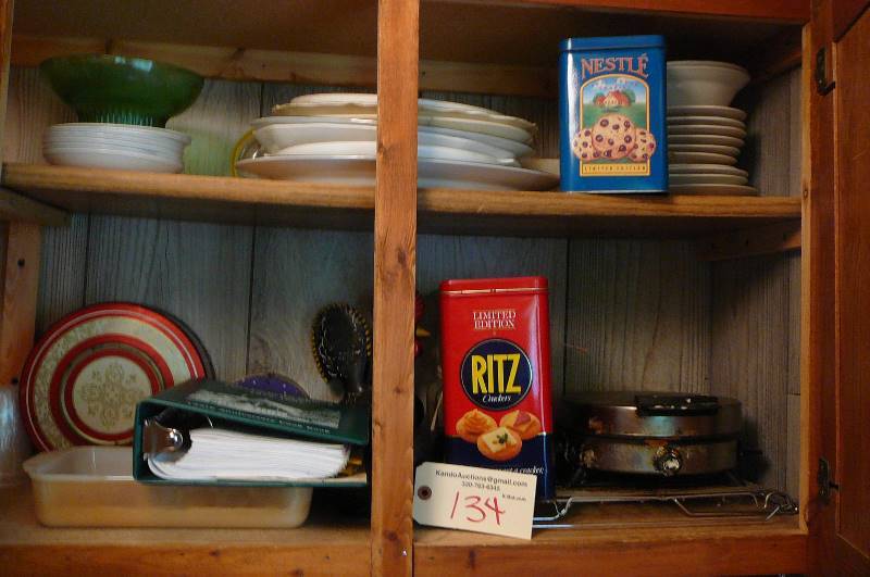 lot 134 image: Limited edition Ritz Cracker tin, Nestle tin, Lot of misc. dishs, waffle iron. Cooling racks, baking dish, Cook book