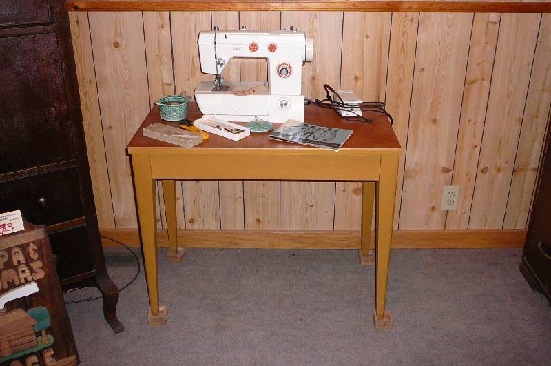 lot 174 image: Montgomery wards sewing machine and stand, rotary cutter, Pinking sheers, pin cushion