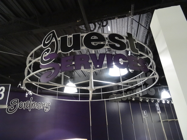 lot 133 image: Aluminum Ceiling Hung Guest Services Sign