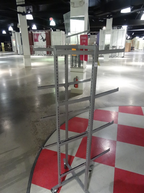 lot 82 image: Metal Retail Clothes Rack on Wheels.