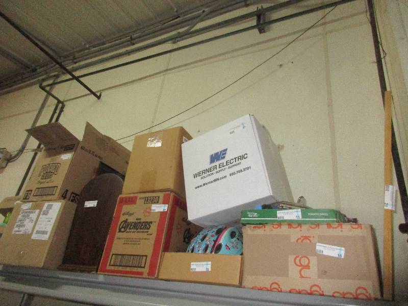 everything on top shelf - kids stuff - roller blades - dolls - bike helmet - white board ect