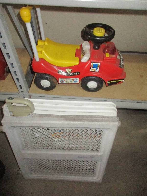 2 baby gates and fire truck toy