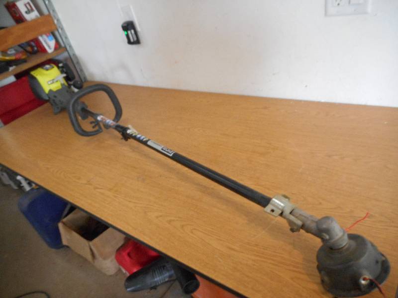 lot 36 image: Ryobi 4-Cycle 30cc Attachment Capable Straight Shaft Gas Trimmer