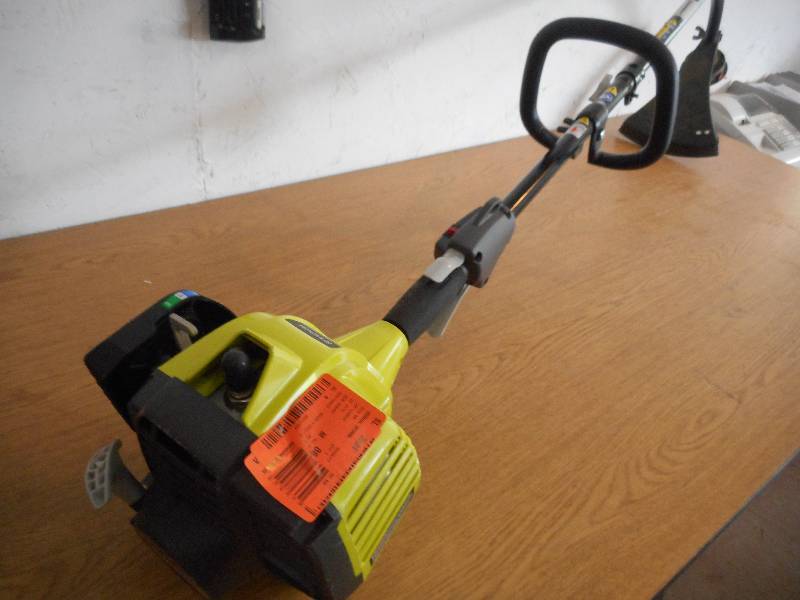 lot 38 image: Ryobi 25 cc 2-Cycle Full Crank Curved Shaft Gas String Trimmer