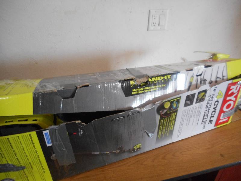 lot 61 image: Ryobi 4-Cycle 30cc Attachment Capable Straight Shaft Gas Trimmer