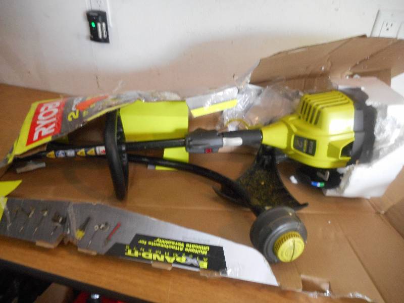 lot 64 image: Ryobi 25 cc 2-Cycle Full Crank Curved Shaft Gas String Trimmer