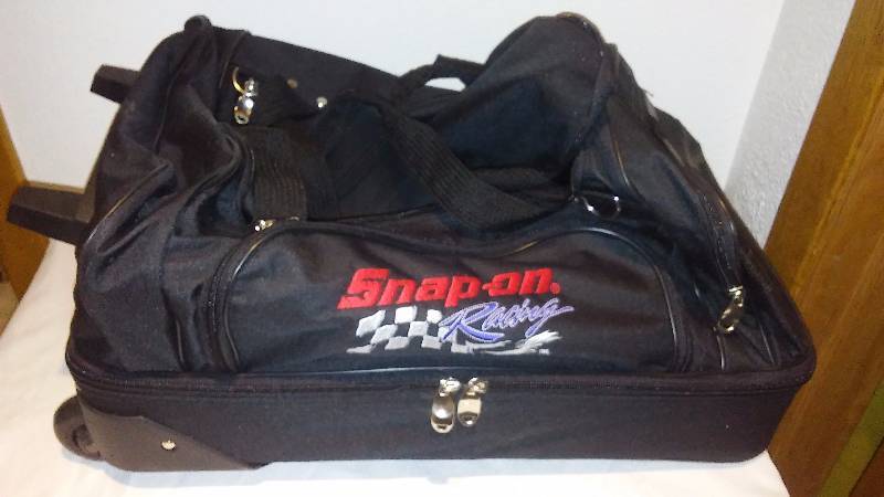 lot 1 image: Snap-on Racing Rolling Travel Bag 22 x 13 x13, Handle extends 15 inches