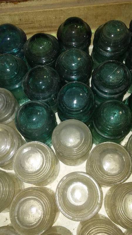 lot 136 image: Glass Insulators (49) Blue (30) Clear (19) 16 ounce COKE bottle