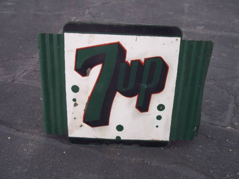 lot 9 image: Vintage 1940s Stout 7up corrugated sign