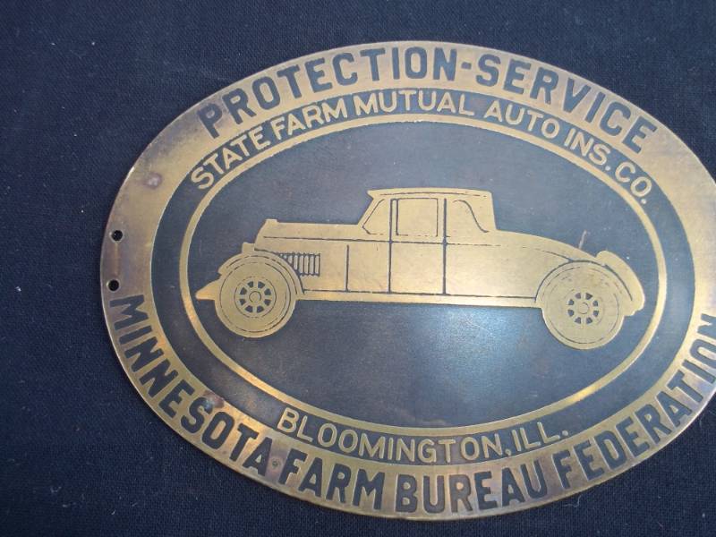 lot 87 image: Vintage Brass Minnesota State Farm License Plate Tag
