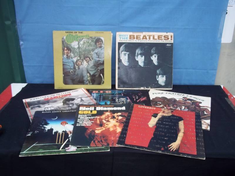 lot 96 image: Lot of 8 Vintage Rock Records including Beatles, Monkeys, etc