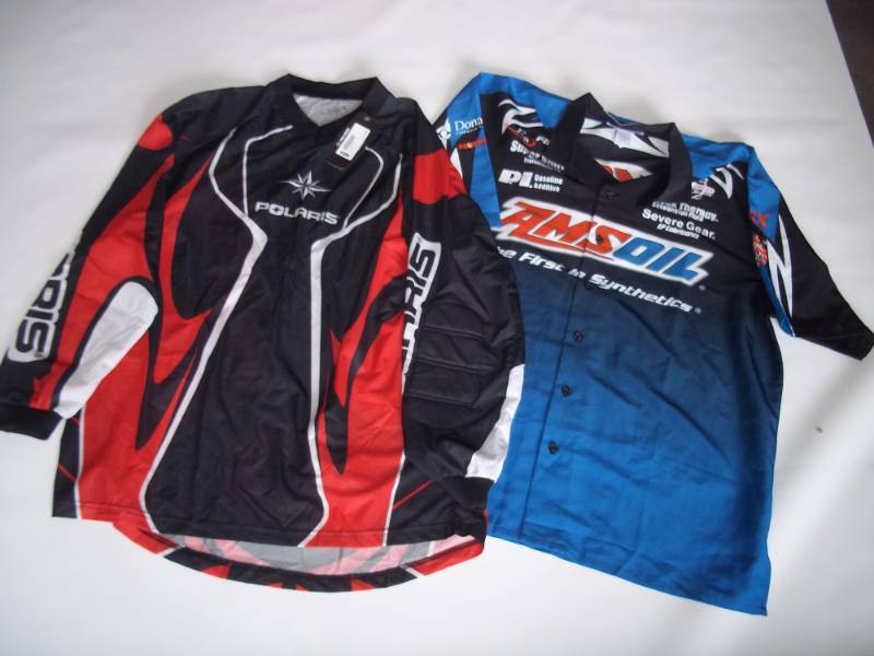 lot 163 image: Lot of 2 shirts  Polaris riding Shirt new with tags Med and AMS oil shirt lg